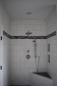 Walk-in shower installation with hand shower